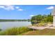 Waterfront view of picnic tables on a deck overlooking the lake at 240 Woodbrook Way, Moncks Corner, SC 29461