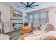 Cozy living room featuring a modern fireplace, large windows, and comfortable seating arrangements at 240 Woodbrook Way, Moncks Corner, SC 29461