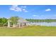 Exterior shot of a picnic shelter complete with picnic tables near the lake at 240 Woodbrook Way, Moncks Corner, SC 29461