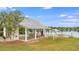 Exterior shot of a picnic shelter complete with picnic tables and trash can near the lake at 240 Woodbrook Way, Moncks Corner, SC 29461