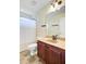 Bright bathroom featuring a wood vanity with a beige countertop and a shower with a white curtain at 249 Old Savannah Dr, Goose Creek, SC 29445
