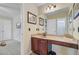 Cozy bathroom featuring a vanity area and sink, with stylish decor; access to bedroom at 249 Old Savannah Dr, Goose Creek, SC 29445