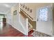 Inviting foyer with hardwood floors, staircase, and a decorative glass front door, creating a warm welcome at 249 Old Savannah Dr, Goose Creek, SC 29445