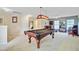 Open game room with a pool table, bar, and cozy seating, perfect for entertaining and relaxation at 249 Old Savannah Dr, Goose Creek, SC 29445