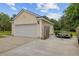 Detached garage with ample parking space and side yard access, perfect for storage and projects at 249 Old Savannah Dr, Goose Creek, SC 29445