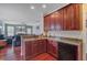 An eat-in kitchen has granite countertops, wood floors, and dark wood cabinets at 249 Old Savannah Dr, Goose Creek, SC 29445
