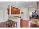 An open kitchen features dark wood cabinets, granite countertops, and seating at the breakfast bar at 249 Old Savannah Dr, Goose Creek, SC 29445
