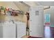The laundry room features a washer, dryer, and wire shelving at 249 Old Savannah Dr, Goose Creek, SC 29445