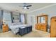 The main bedroom has neutral walls, carpet, and a ceiling fan at 249 Old Savannah Dr, Goose Creek, SC 29445
