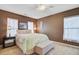 Relaxing main bedroom with soft carpet, natural light, and a cozy bed dressed with a quilt at 249 Old Savannah Dr, Goose Creek, SC 29445