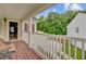 Charming covered porch with wooden bench and a view of the backyard, perfect for relaxing outdoors at 249 Old Savannah Dr, Goose Creek, SC 29445