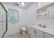 Bright bathroom featuring a modern vanity, toilet, and glass-enclosed shower at 2736 Shadow Ln, North Charleston, SC 29406