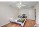 A bedroom with a bed, ceiling fan, and door to the backyard at 2736 Shadow Ln, North Charleston, SC 29406