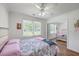 Cozy bedroom features hardwood floors, natural light and mirrored closet doors at 2736 Shadow Ln, North Charleston, SC 29406