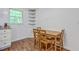 Cozy dining area with a table and chairs next to the kitchen, illuminated by a bright window at 2736 Shadow Ln, North Charleston, SC 29406
