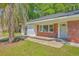 A charming brick home with a manicured lawn and a quaint, welcoming front entrance at 2736 Shadow Ln, North Charleston, SC 29406