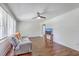 Inviting living room with hardwood floors, ceiling fan, and natural light streaming through the windows at 2736 Shadow Ln, North Charleston, SC 29406