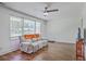 Spacious living room with hardwood floors, a comfortable couch, and large windows at 2736 Shadow Ln, North Charleston, SC 29406