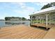 Picturesque dock featuring a covered pavilion on a tranquil lake, perfect for relaxing waterfront living at 291 Calm Water Way, Summerville, SC 29486