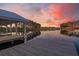 Breathtaking sunset view of a dock on a calm lake, reflecting vibrant colors and serene waterfront living at 291 Calm Water Way, Summerville, SC 29486