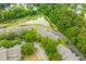 An aerial view of a residential neighborhood featuring lush greenery and a serene pond at 2948 Treadwell Street St, Mount Pleasant, SC 29466