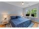 Comfortable bedroom features a ceiling fan, natural light, and a dedicated workspace at 2948 Treadwell Street St, Mount Pleasant, SC 29466