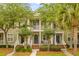 Charming townhomes with double front porches, landscaping, and mature trees, ideal for community living at 2948 Treadwell Street St, Mount Pleasant, SC 29466