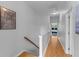 Bright hallway featuring hardwood floors that lead to the bedrooms for a peaceful retreat at 2948 Treadwell Street St, Mount Pleasant, SC 29466