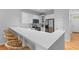 Bright kitchen with white cabinets, quartz countertops, and breakfast bar that is perfect for casual dining at 2948 Treadwell Street St, Mount Pleasant, SC 29466