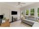 Cozy living room with a comfortable couch, desk space, and natural light streaming through the windows at 2948 Treadwell Street St, Mount Pleasant, SC 29466