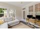 Bright living room featuring a comfortable sectional couch and desk space with dual monitors at 2948 Treadwell Street St, Mount Pleasant, SC 29466