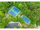 An aerial shot of well-maintained tennis courts surrounded by lush greenery and a parking lot at 2948 Treadwell Street St, Mount Pleasant, SC 29466