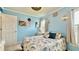 Cozy bedroom featuring light blue walls, comfortable bedding, and bright natural light at 302 Axeminster Ct, Goose Creek, SC 29445