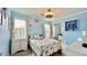 Charming bedroom with light blue walls, nautical-themed bedding, and ample natural light at 302 Axeminster Ct, Goose Creek, SC 29445