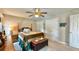 Comfortable bedroom with a four-poster bed, ceiling fan, and double closets at 302 Axeminster Ct, Goose Creek, SC 29445