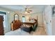 Cozy bedroom with decorative mirror, wood floors, and a plush quilt at 302 Axeminster Ct, Goose Creek, SC 29445