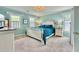 Relaxing main bedroom features a large bed, soft carpet, and ample natural light from two windows at 302 Axeminster Ct, Goose Creek, SC 29445