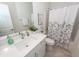 Modern bathroom with a white vanity, decorative art, and shower-tub combo at 305 Flowering Peach Ct # 202, Charleston, SC 29414