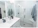 Bright bathroom features vanity, walk in shower with glass enclosure and tiled surround at 305 Flowering Peach Ct # 202, Charleston, SC 29414