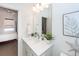 Ensuite bathroom features a white sink, quartz countertop, and modern fixtures at 305 Flowering Peach Ct # 202, Charleston, SC 29414