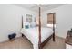 Bedroom with neutral carpet, a ceiling fan, wood-trimmed windows, and a four-poster bed at 305 Flowering Peach Ct # 202, Charleston, SC 29414
