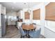 Eat in kitchen includes stainless appliances, white cabinets, and breakfast table for four at 305 Flowering Peach Ct # 202, Charleston, SC 29414