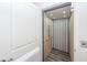 Convenient home elevator with a modern interior, safety features and easy access at 305 Flowering Peach Ct # 202, Charleston, SC 29414
