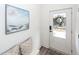 Bright entryway with beachy art, comfortable seating and stylish decor providing an inviting space at 305 Flowering Peach Ct # 202, Charleston, SC 29414