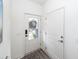 Entryway showcases a glass front door with digital keypad, a warm rug, and crisp, white paint at 305 Flowering Peach Ct # 202, Charleston, SC 29414