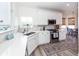 Well-lit kitchen features white cabinets, stainless steel appliances, and quartz countertops at 305 Flowering Peach Ct # 202, Charleston, SC 29414