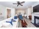 Inviting living room featuring a fireplace, ceiling fan, stylish furniture and wood-look flooring at 305 Flowering Peach Ct # 202, Charleston, SC 29414