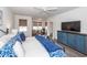 Spacious main bedroom with a seating area, TV, and stylish accents at 305 Flowering Peach Ct # 202, Charleston, SC 29414