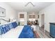 Bright and airy main bedroom with a seating area and stylish decor at 305 Flowering Peach Ct # 202, Charleston, SC 29414