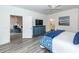 Inviting bedroom with TV and ensuite bathroom entrance at 305 Flowering Peach Ct # 202, Charleston, SC 29414